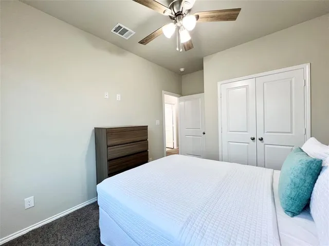 a view of roof with wooden floor and fence