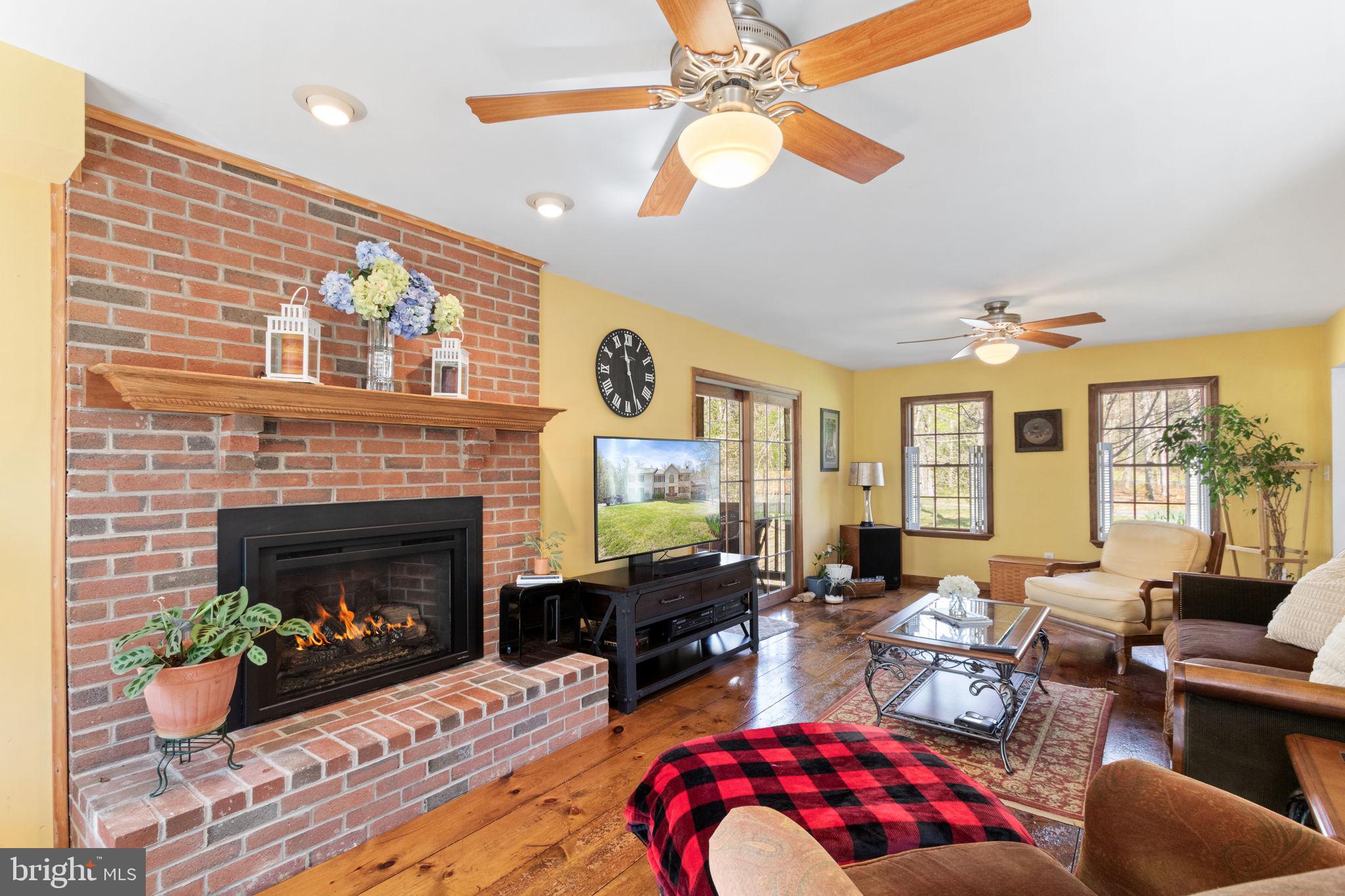 135 Cropp Road Fredericksburg, VA 22406 - Photo 12 of 67 a living room with furniture fireplace and a large window