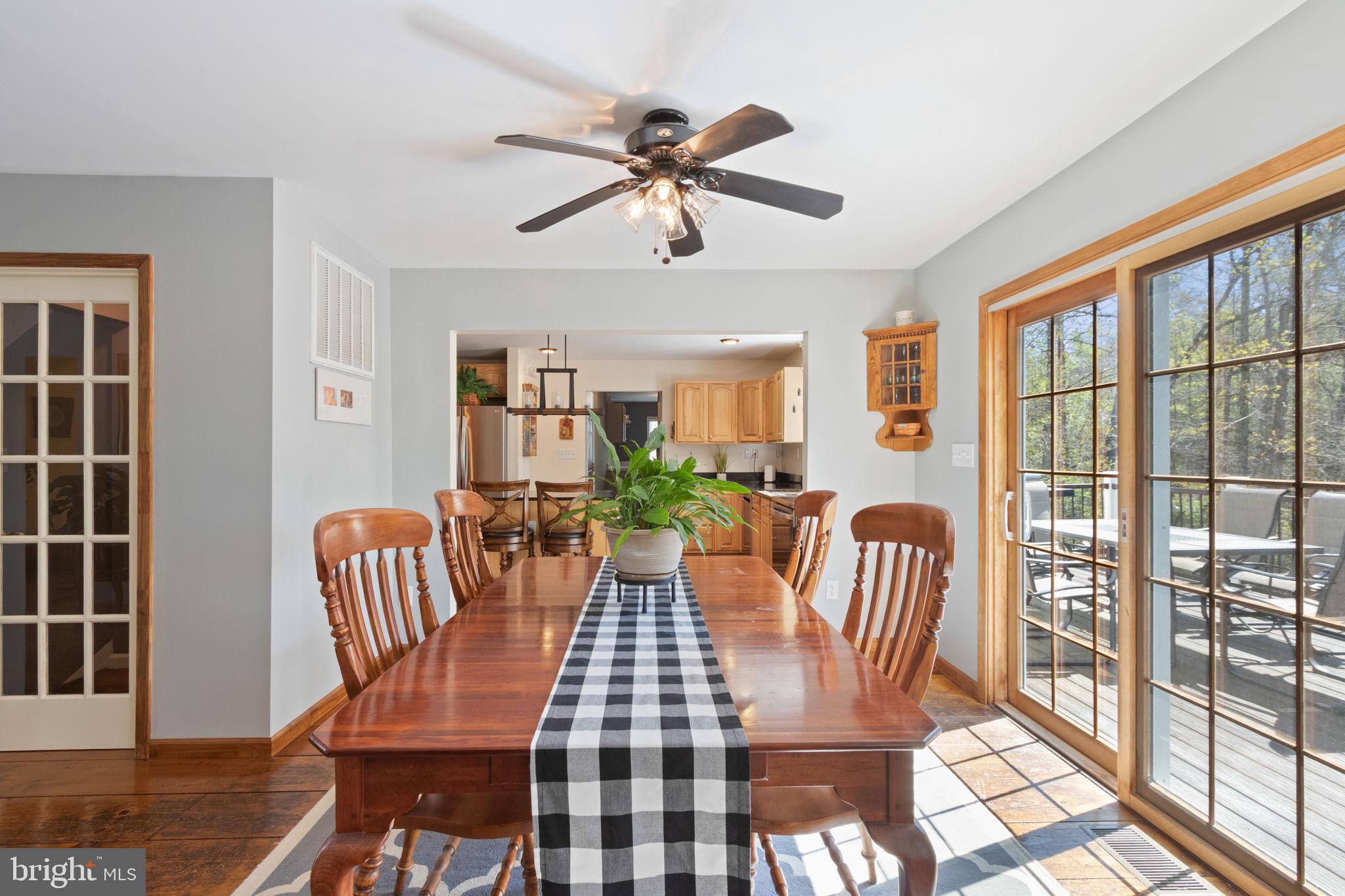 135 Cropp Road Fredericksburg, VA 22406 - Photo 25 of 67 a view of a dining room with furniture window and wooden floor