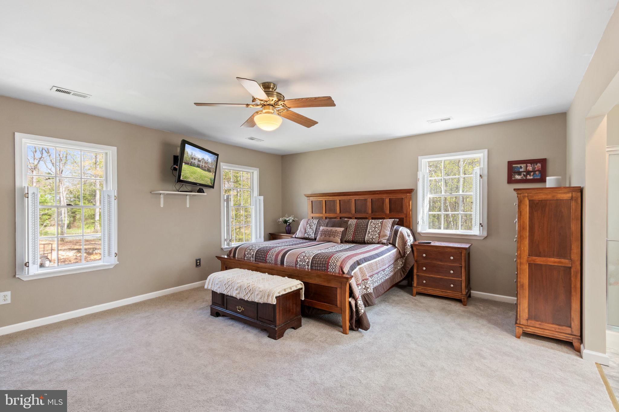 135 Cropp Road Fredericksburg, VA 22406 - Photo 30 of 67 a spacious bedroom with a bed and a window