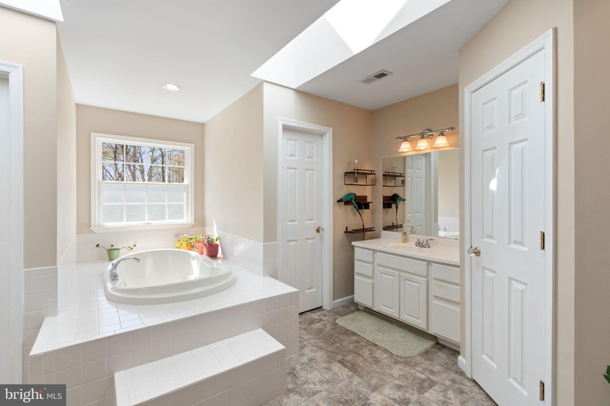 135 Cropp Road Fredericksburg, VA 22406 - Photo 34 of 67 a spacious bathroom with a sink double vanity and a mirror