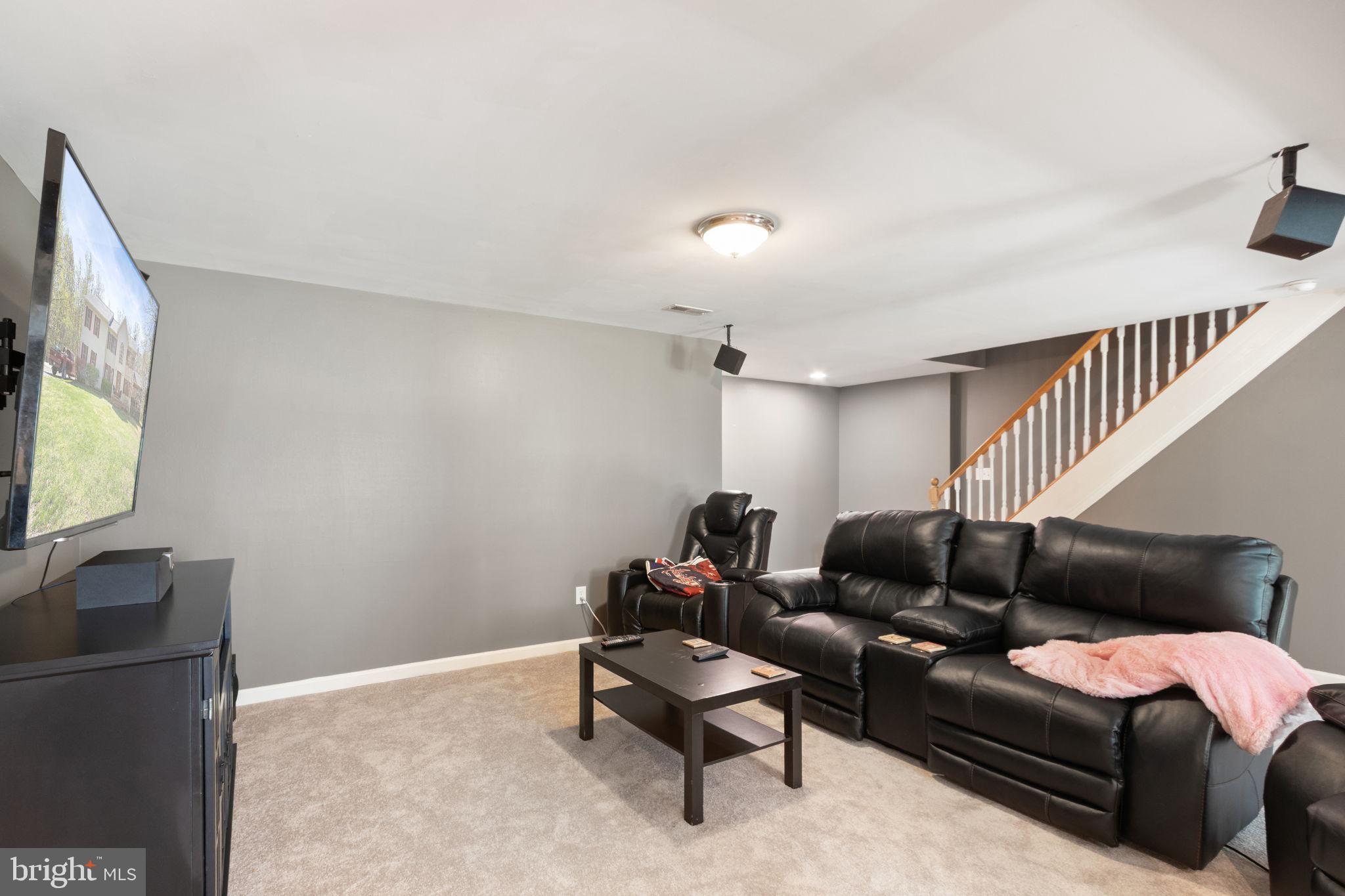 135 Cropp Road Fredericksburg, VA 22406 - Photo 48 of 67 a living room with furniture and a flat screen tv
