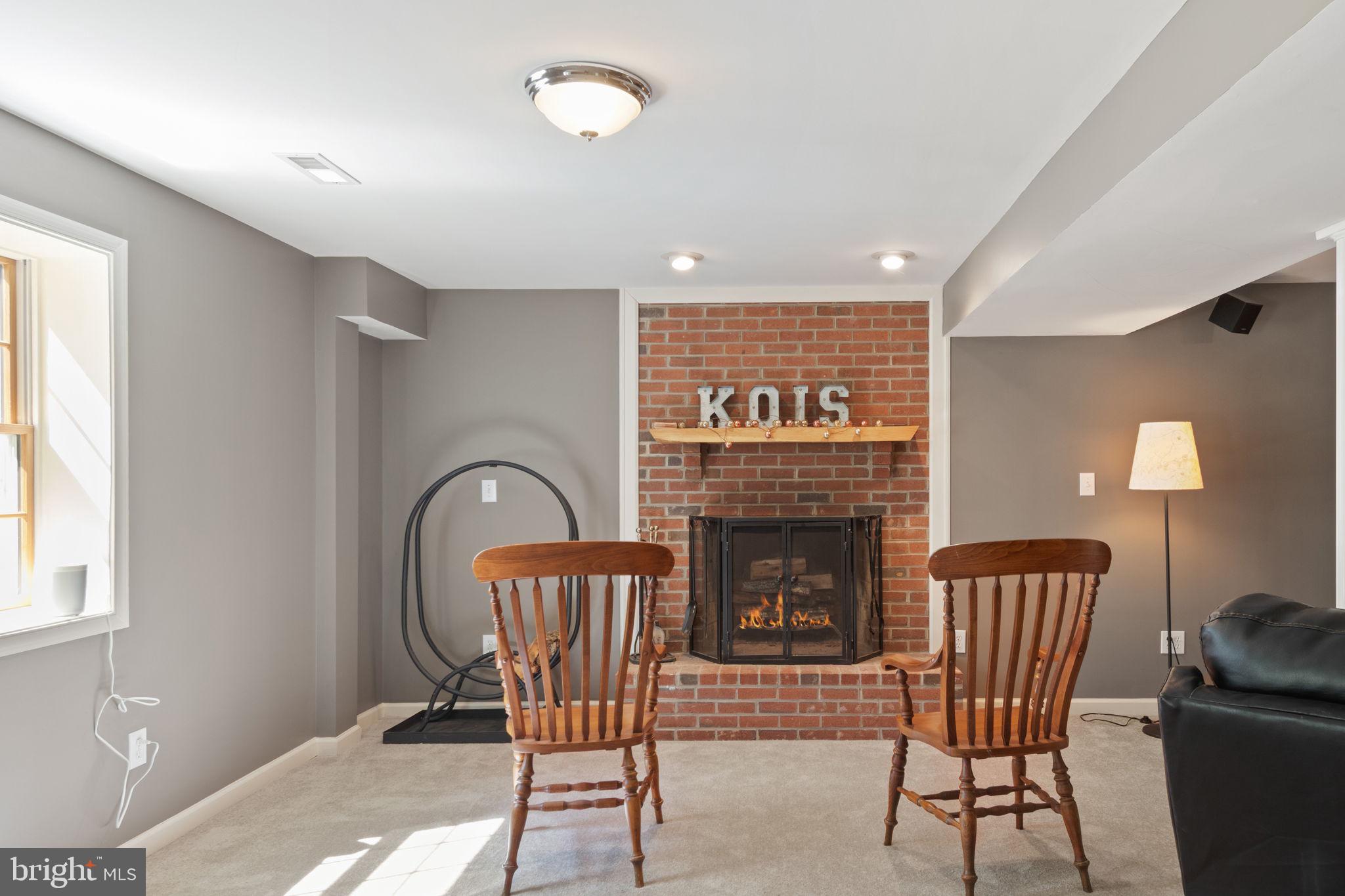 135 Cropp Road Fredericksburg, VA 22406 - Photo 49 of 67 a living room with furniture and a fireplace