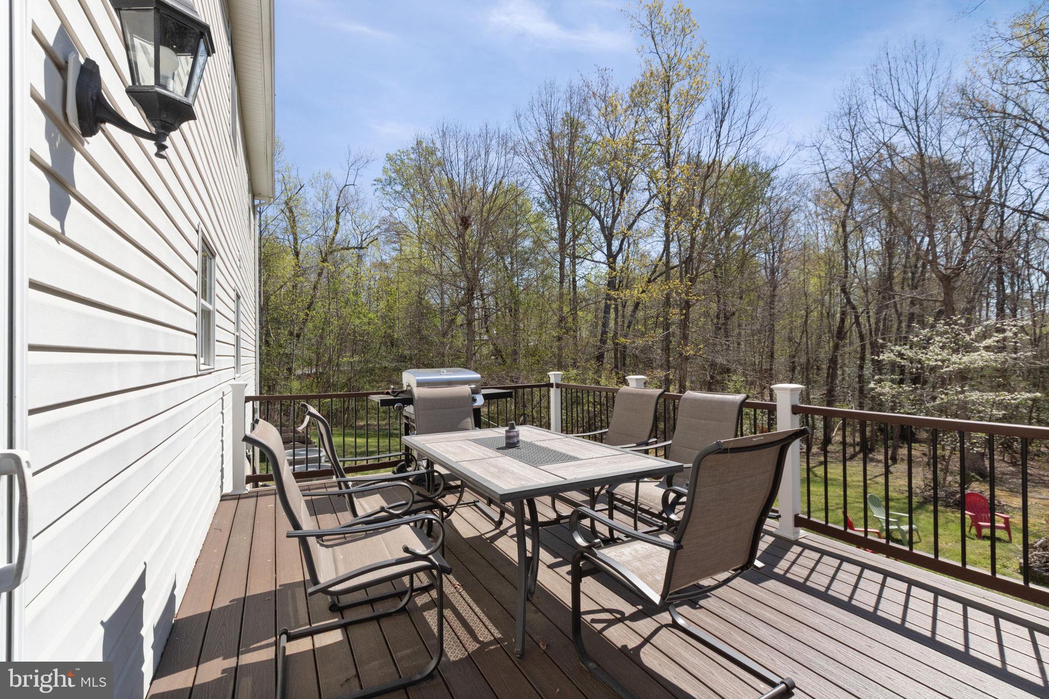 135 Cropp Road Fredericksburg, VA 22406 - Photo 54 of 67 a view of a chairs and table on the deck