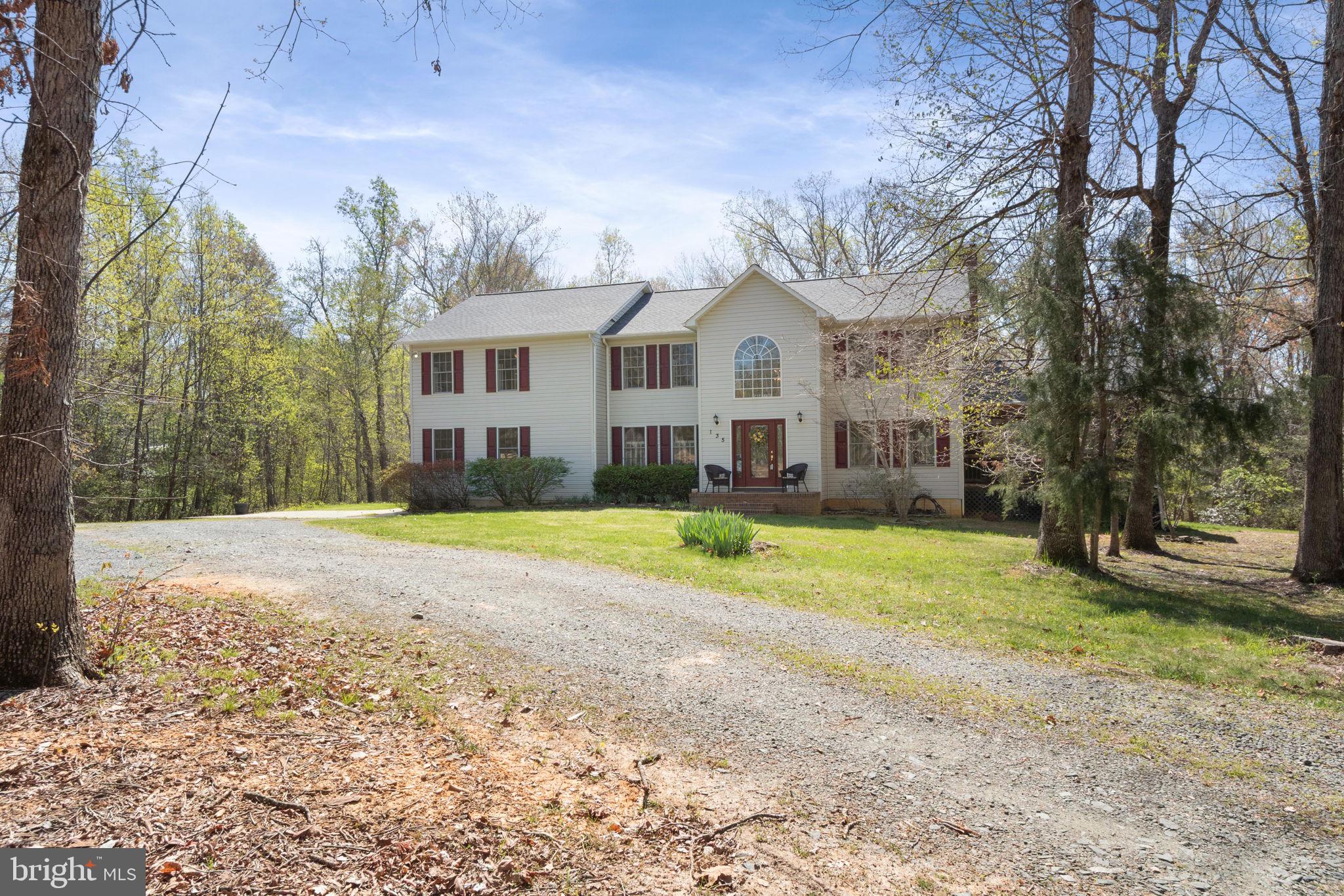 135 Cropp Road Fredericksburg, VA 22406 - Photo 66 of 67 a view of a house with a big yard and large trees