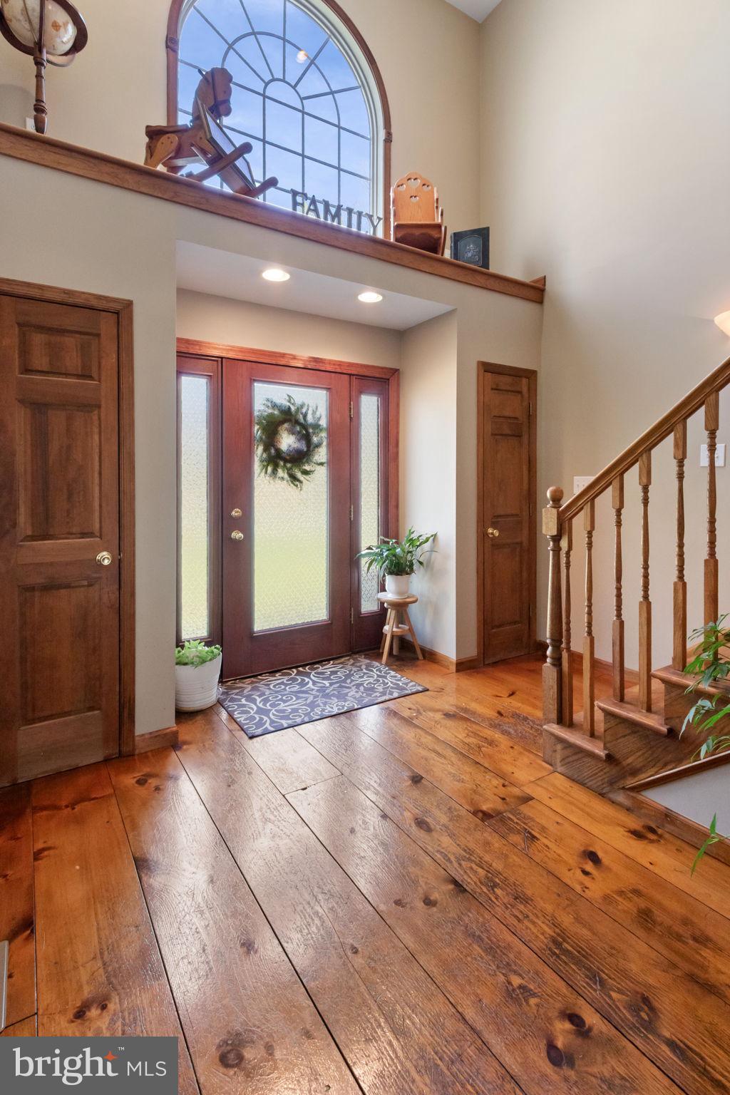 135 Cropp Road Fredericksburg, VA 22406 - Photo 8 of 67 a view of a hallway with wooden floor and a living room