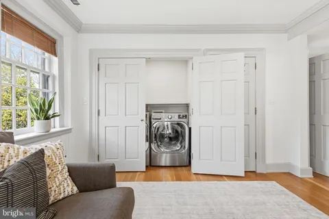 a bathroom with a double vanity sink a mirror and shower