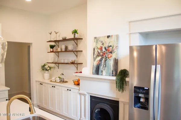 a view of kitchen and cabinets