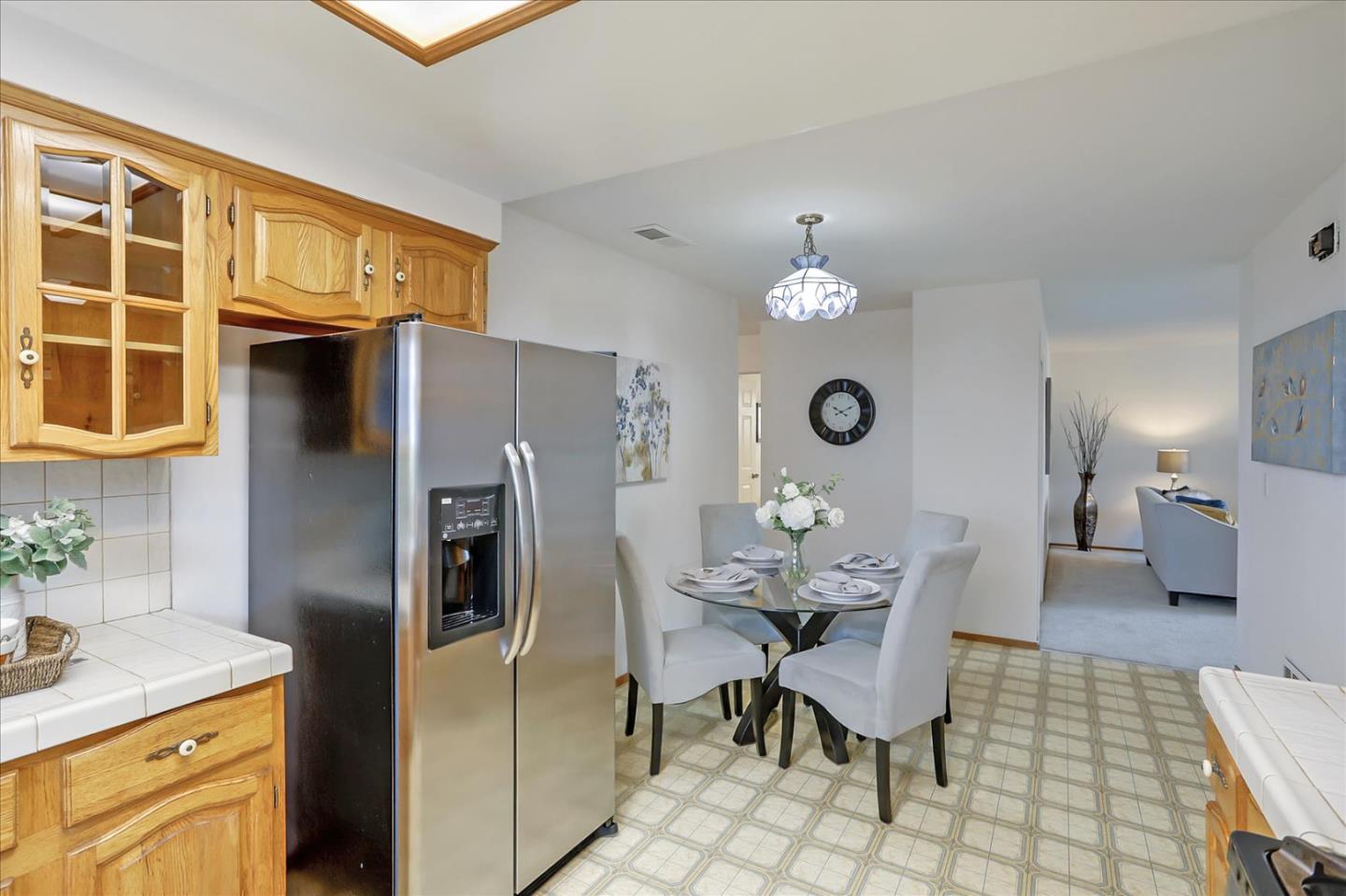 202 Greentree Way Milpitas, CA 95035 - Photo 12 of 28 a kitchen with stainless steel appliances granite countertop a dining table and chairs