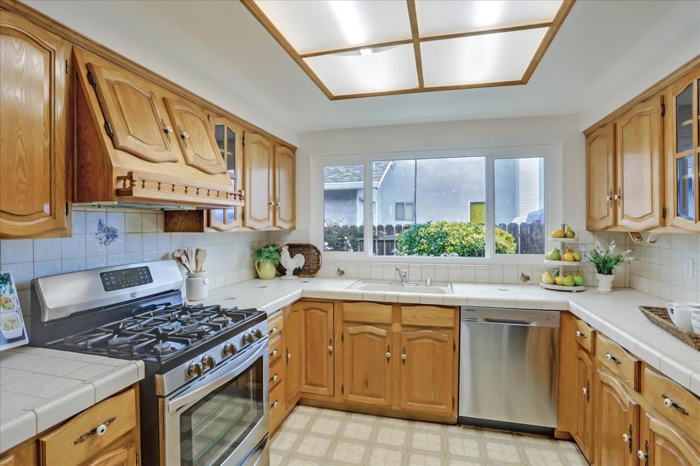 202 Greentree Way Milpitas, CA 95035 - Photo 13 of 28 a kitchen with cabinets appliances a sink and a counter top space