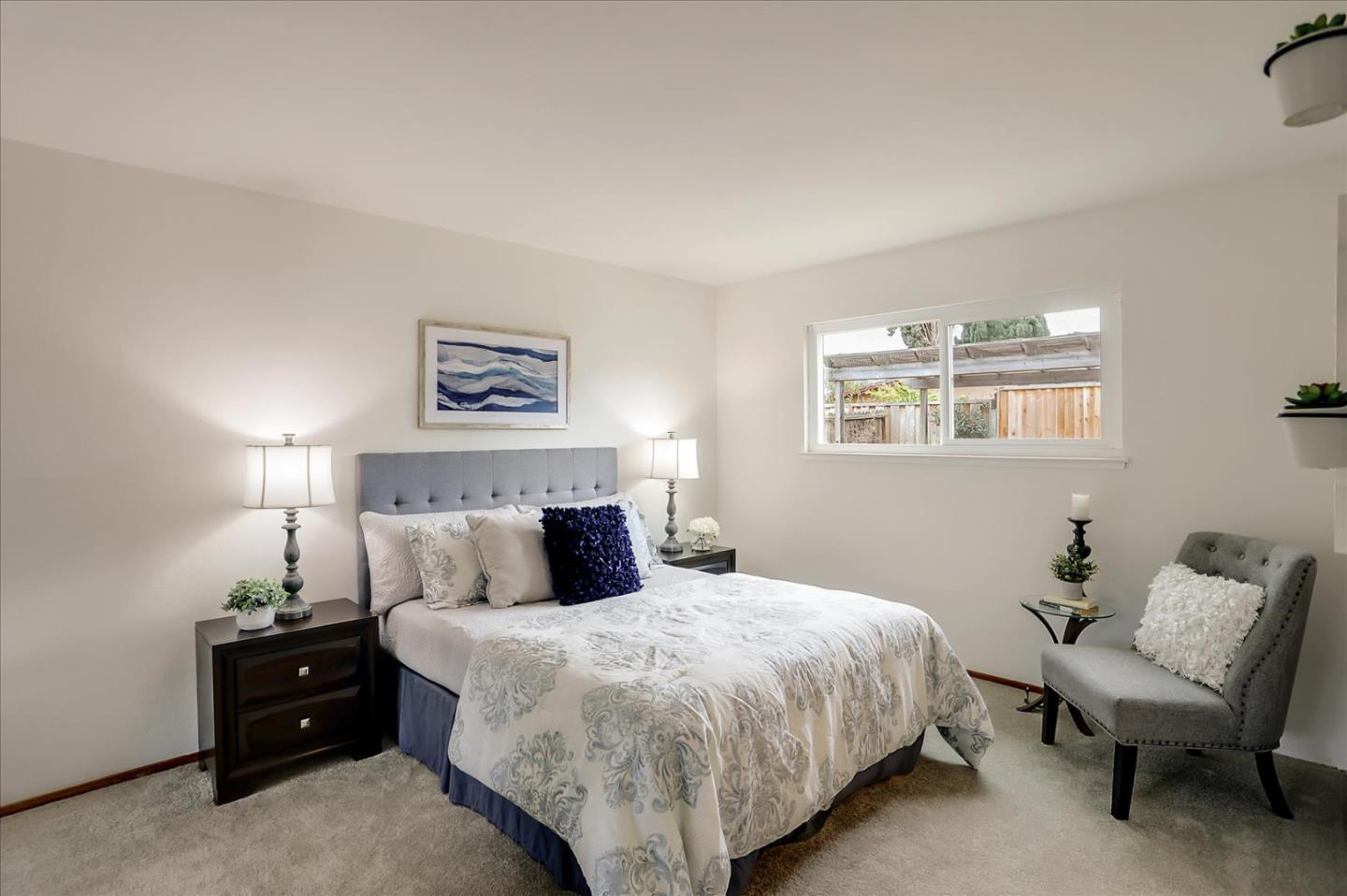 202 Greentree Way Milpitas, CA 95035 - Photo 19 of 28 a bedroom with a bed and a chair