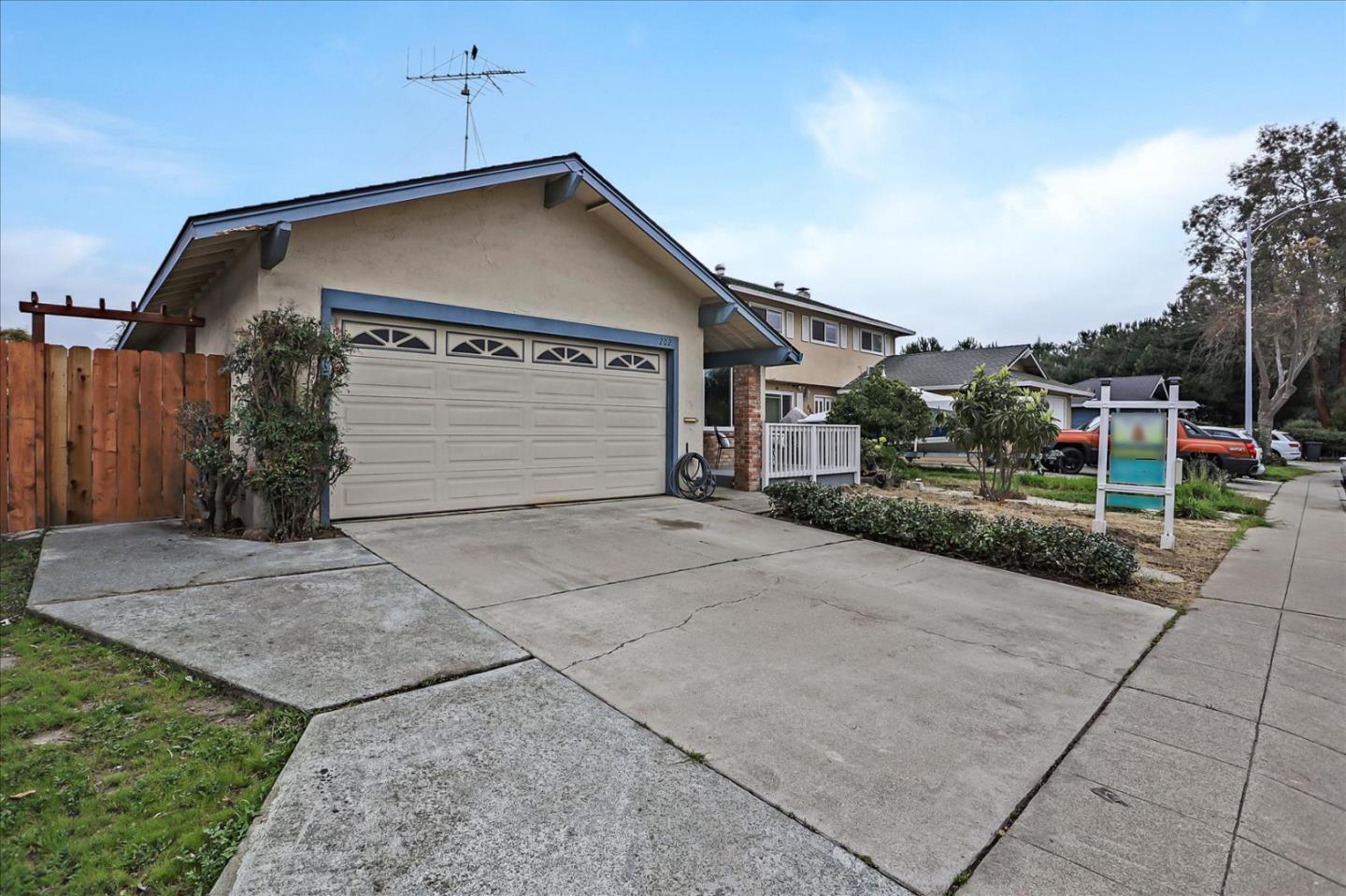 202 Greentree Way Milpitas, CA 95035 - Photo 2 of 28 a front view of a house with a yard and garage