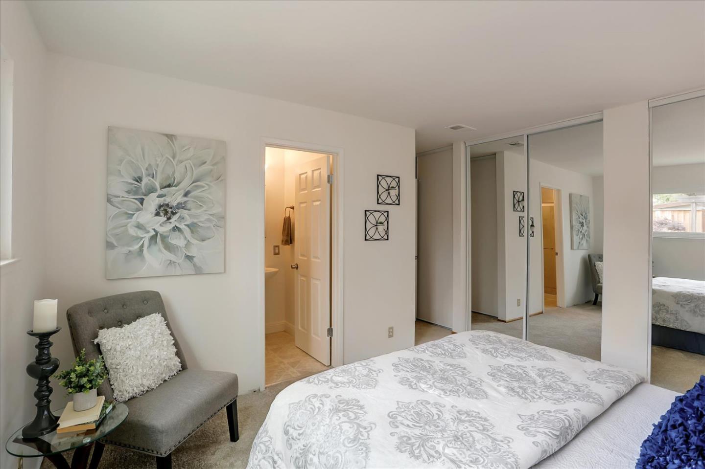 202 Greentree Way Milpitas, CA 95035 - Photo 21 of 28 a spacious bedroom with a bed and a couch