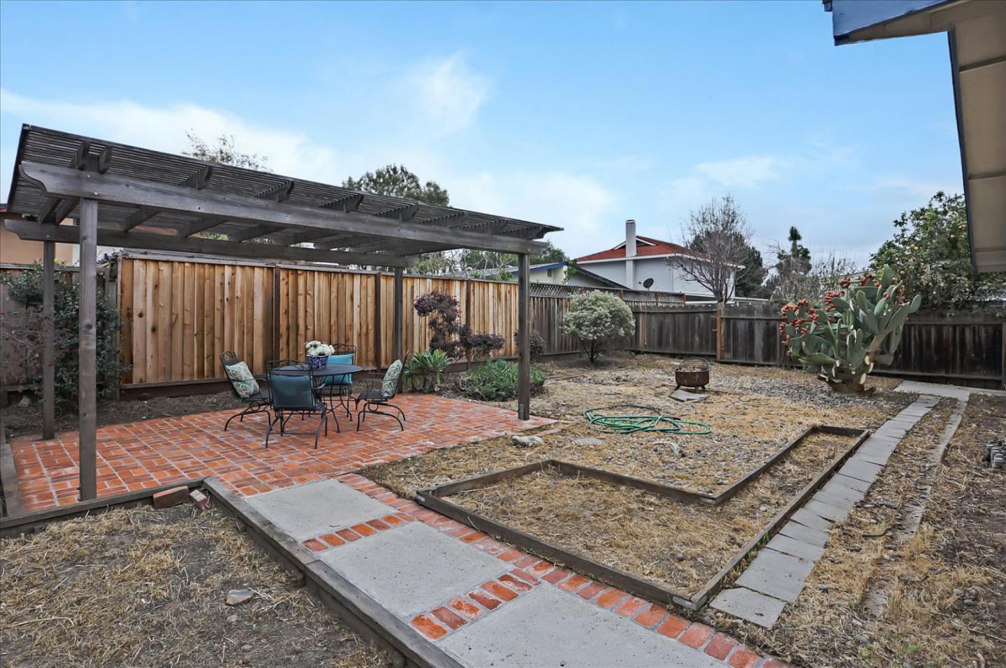 202 Greentree Way Milpitas, CA 95035 - Photo 24 of 28 a view of a backyard with table and chairs