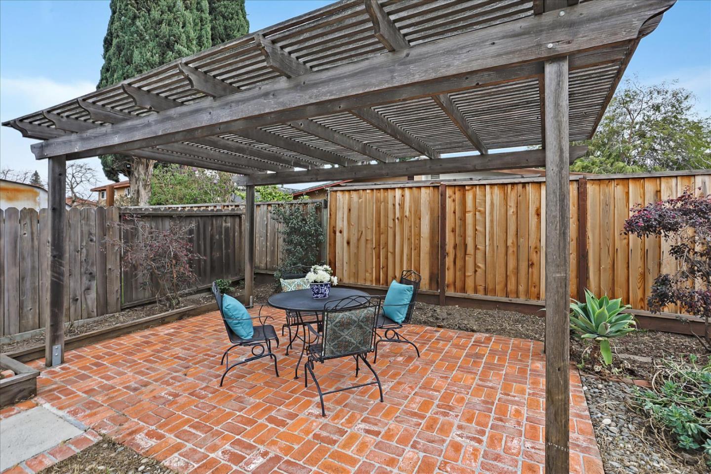202 Greentree Way Milpitas, CA 95035 - Photo 25 of 28 a backyard of a house with a table and chairs