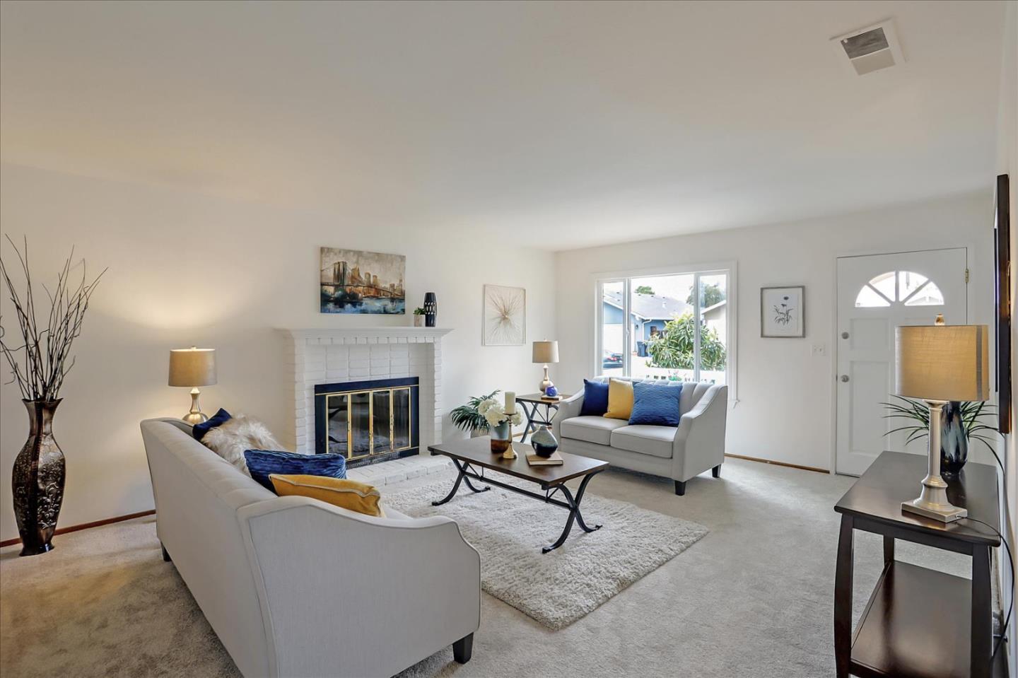 202 Greentree Way Milpitas, CA 95035 - Photo 9 of 28 a living room with furniture and a fireplace