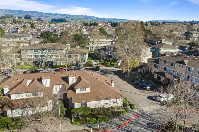 an aerial view of residential houses with outdoor space