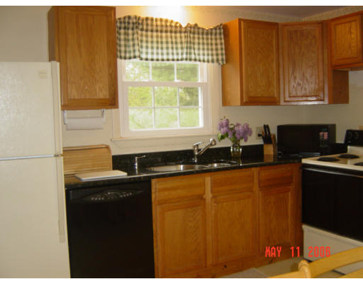 0 Rita Hudson, NH 03051 - Photo 2 of 9 a kitchen with granite countertop cabinets sink and a granite counter top