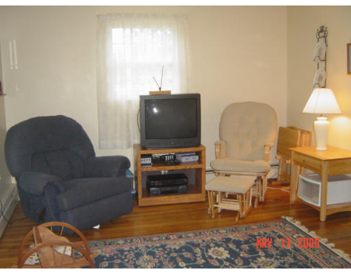 0 Rita Hudson, NH 03051 - Photo 4 of 9 a living room with furniture and a flat screen tv