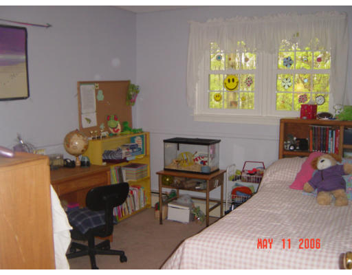0 Rita Hudson, NH 03051 - Photo 5 of 9 a bed room with a bed and a chair