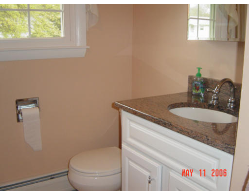 0 Rita Hudson, NH 03051 - Photo 7 of 9 a bathroom with a granite countertop toilet sink and mirror