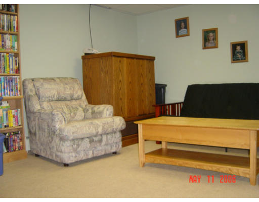 0 Rita Hudson, NH 03051 - Photo 8 of 9 a living room with furniture and a bed