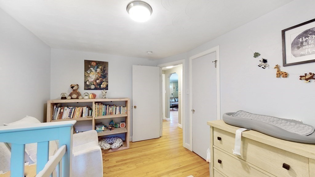12 James Street Winchester, MA 01890 - Photo 12 of 23 a living room with furniture and a book shelf
