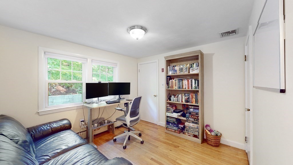 12 James Street Winchester, MA 01890 - Photo 14 of 23 a view of a workspace with furniture and a window