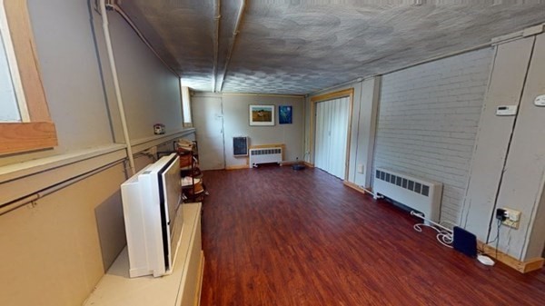 12 James Street Winchester, MA 01890 - Photo 16 of 23 a view of a room with wooden floor and furniture