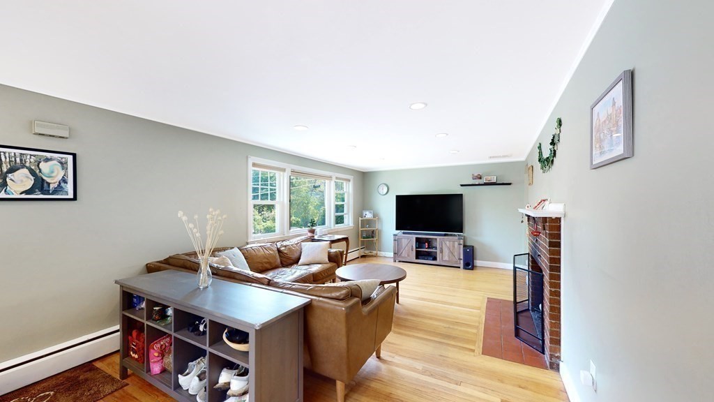 12 James Street Winchester, MA 01890 - Photo 5 of 23 a living room with furniture and a flat screen tv