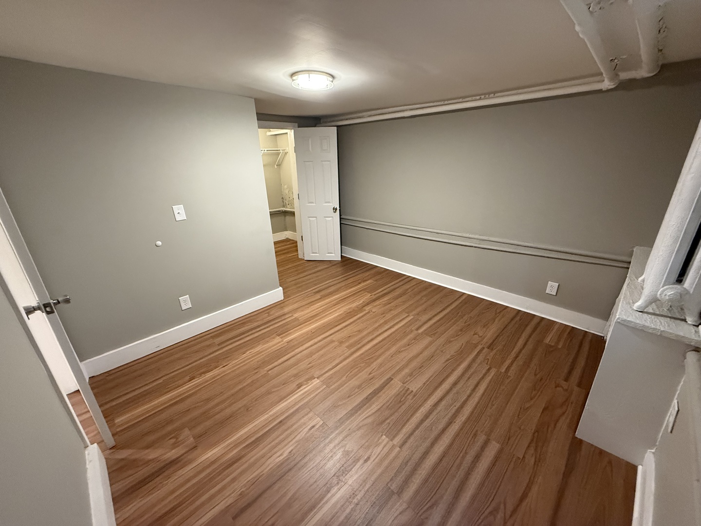 202 South Grove Street Urbana, IL 61802 - Photo 4 of 8 a view of a room with wooden floor