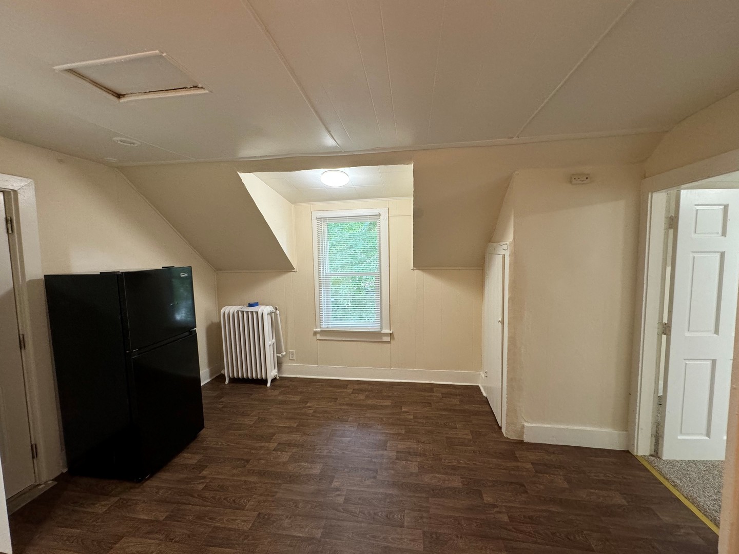 202 South Grove Street Urbana, IL 61802 - Photo 5 of 8 a view of empty room with wooden floor and fan