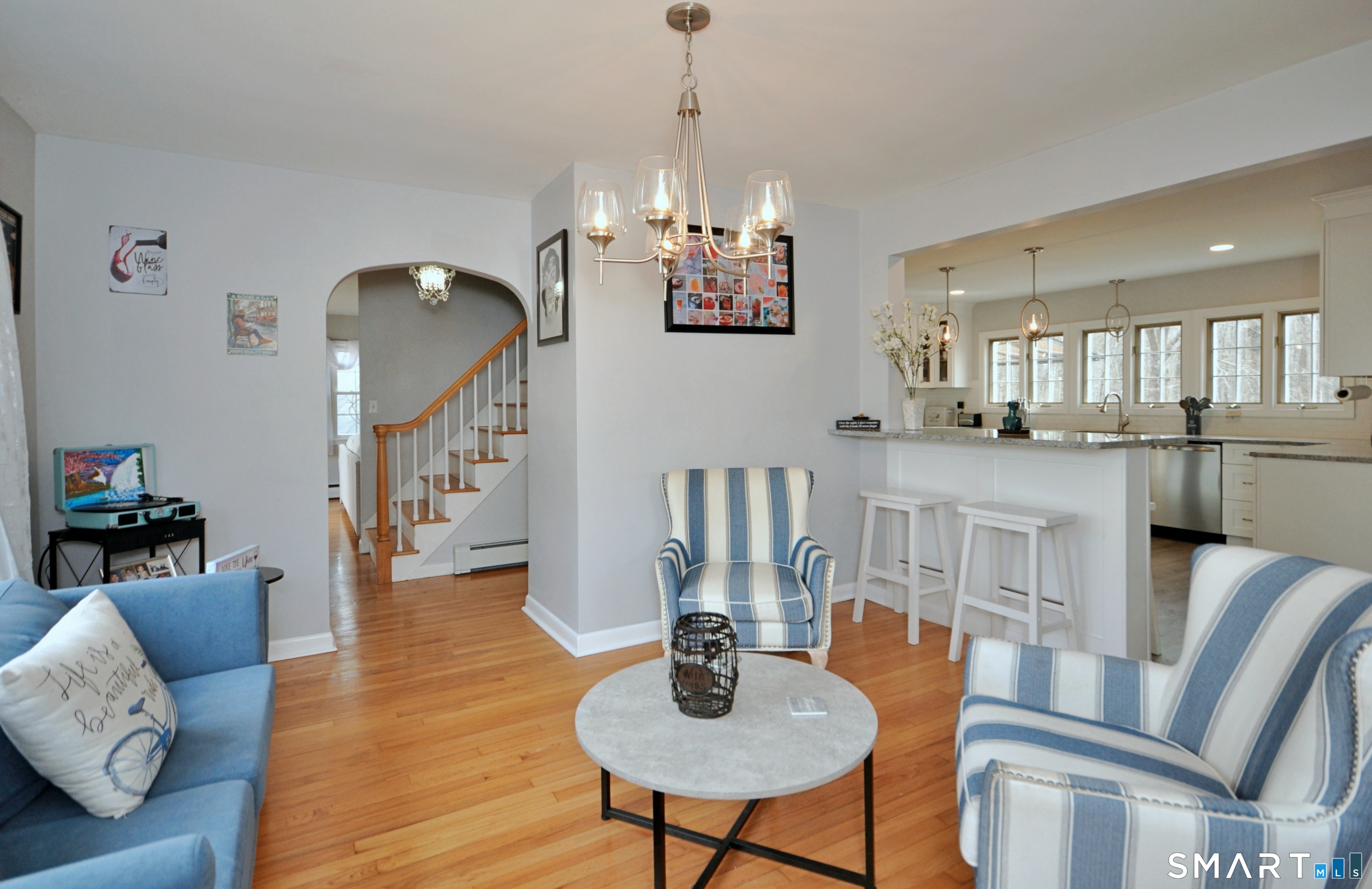 21 Maple Drive Prospect, CT 06712 - Photo 11 of 29 a dining room with furniture a chandelier and wooden floor