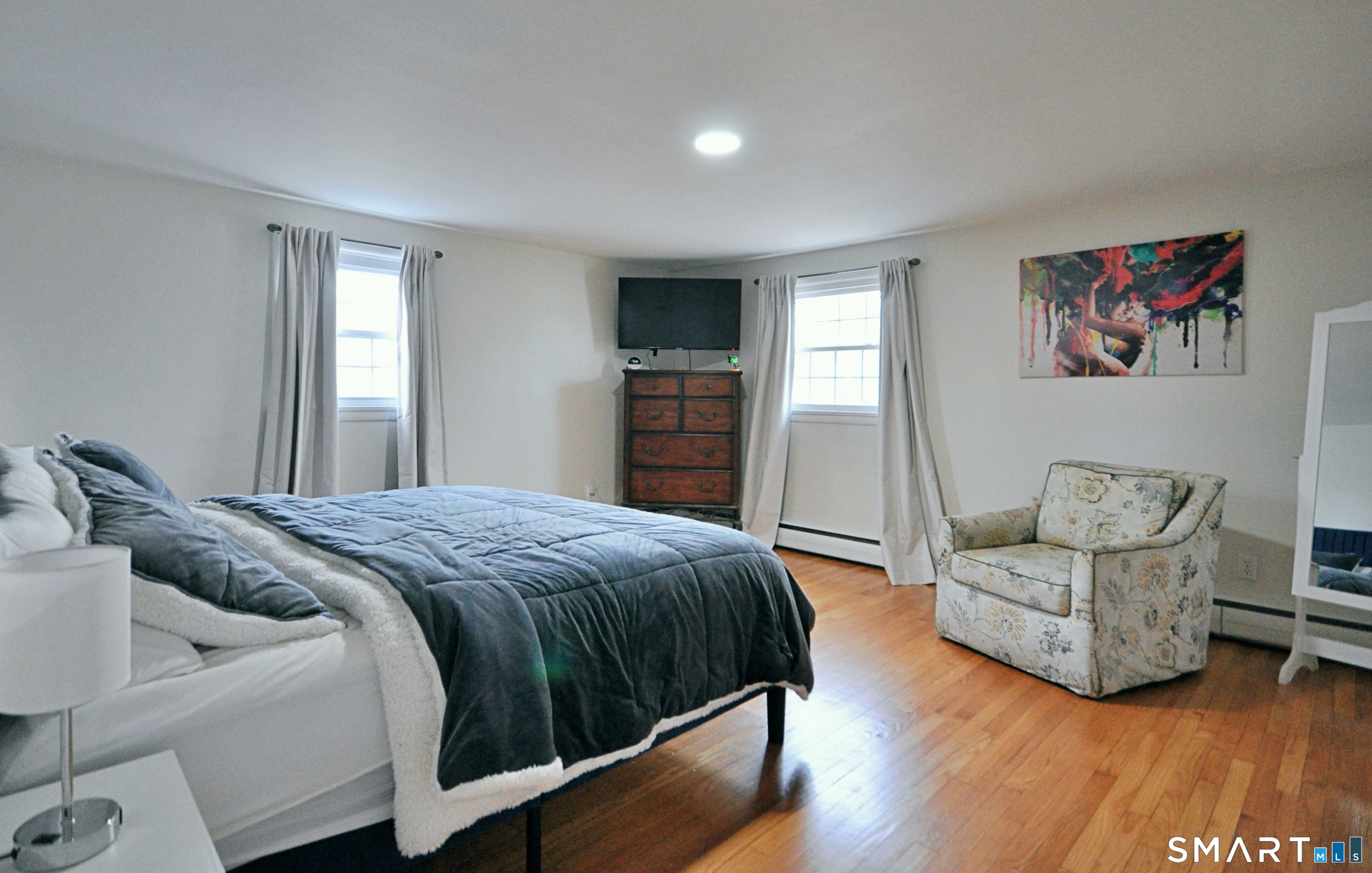 21 Maple Drive Prospect, CT 06712 - Photo 13 of 29 a spacious bedroom with a bed and a couch