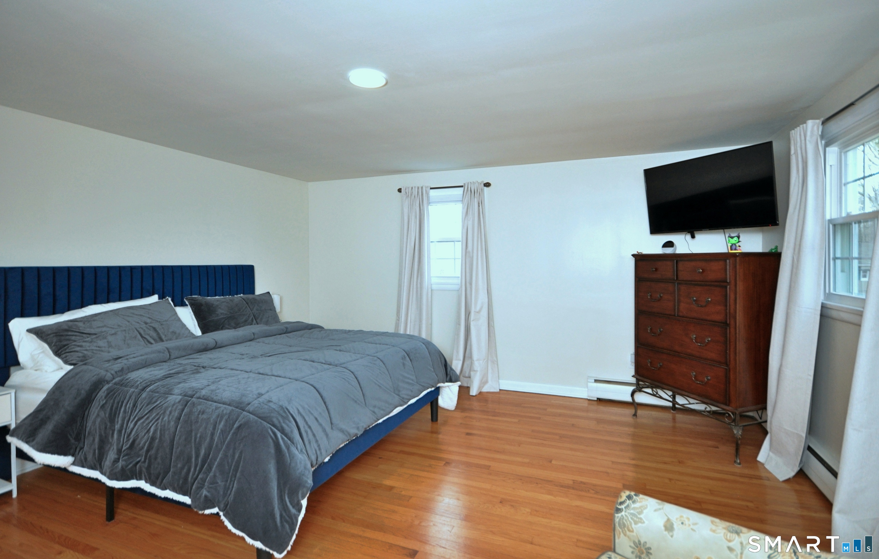 21 Maple Drive Prospect, CT 06712 - Photo 14 of 29 a bedroom with a bed and flat screen tv
