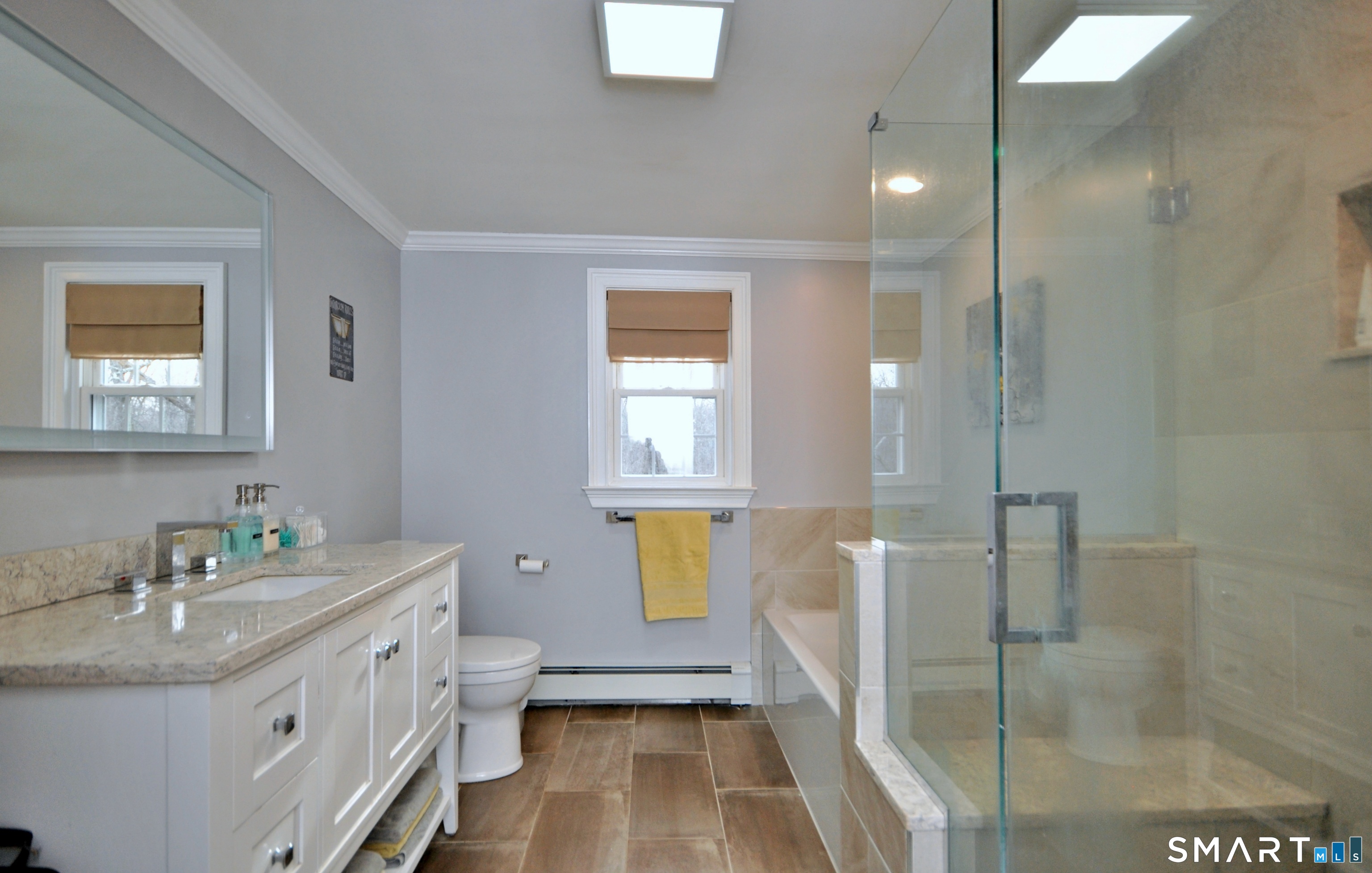 21 Maple Drive Prospect, CT 06712 - Photo 18 of 29 a bathroom with a double vanity sink toilet and shower