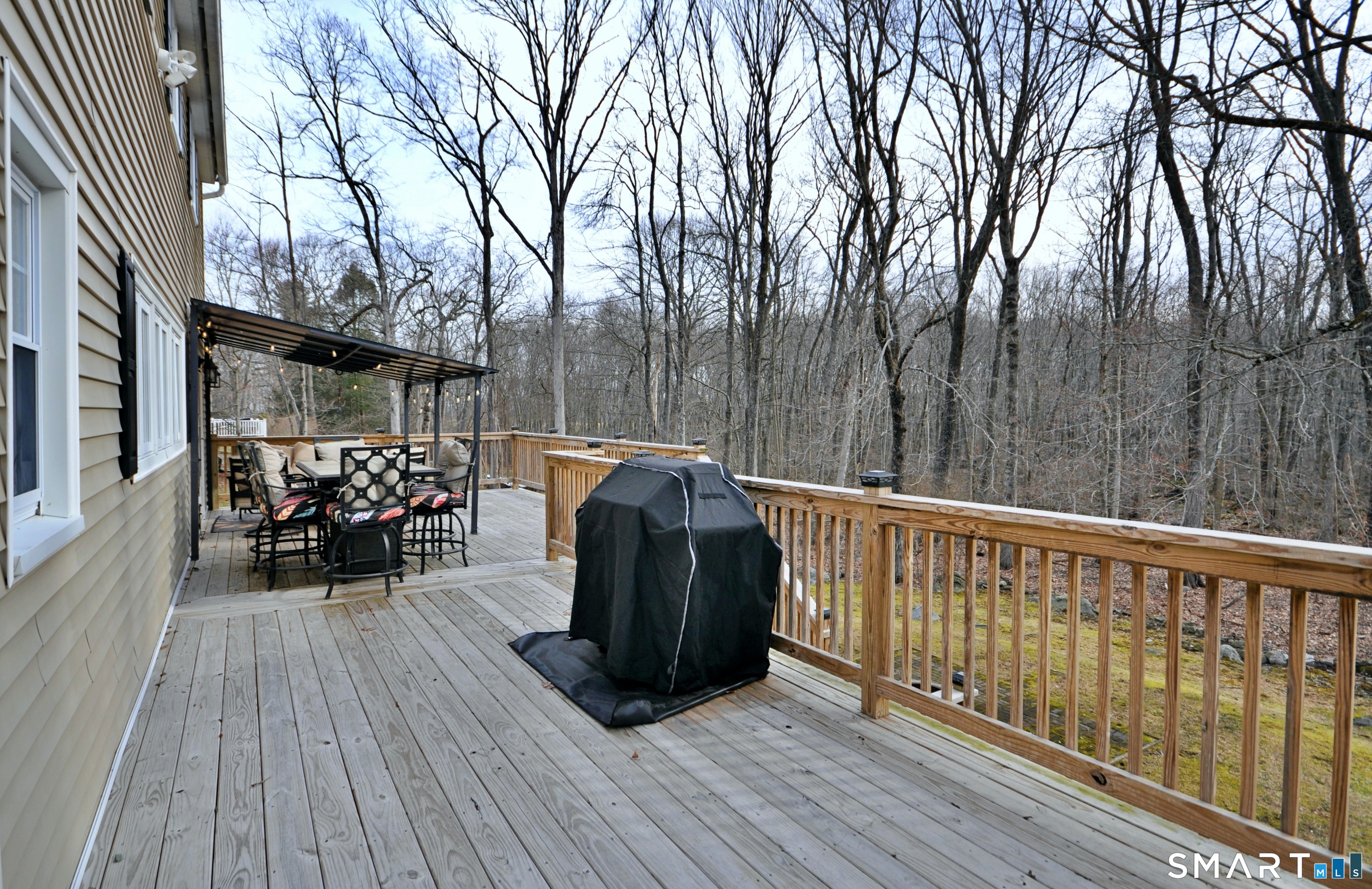 21 Maple Drive Prospect, CT 06712 - Photo 23 of 29 a view of a deck with table and chairs and wooden floor