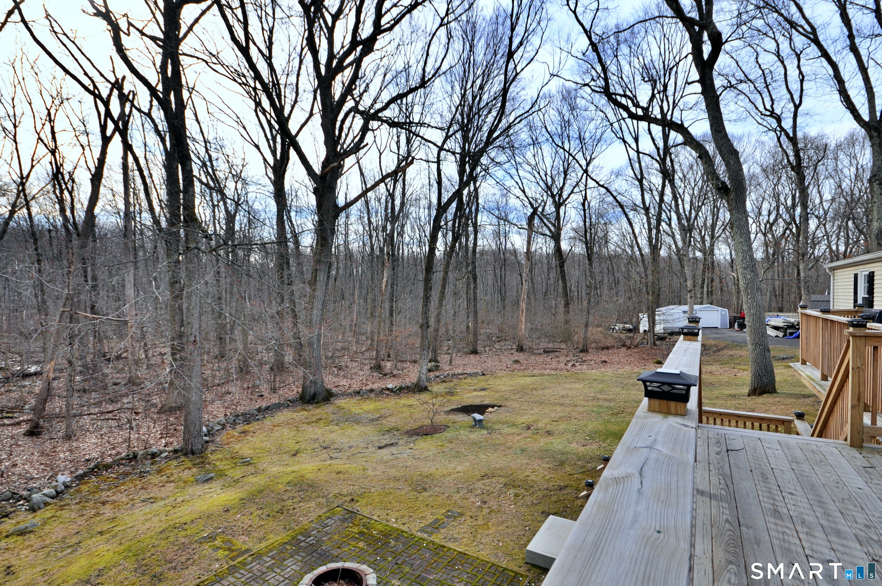 21 Maple Drive Prospect, CT 06712 - Photo 24 of 29 a backyard of a house with table and chairs