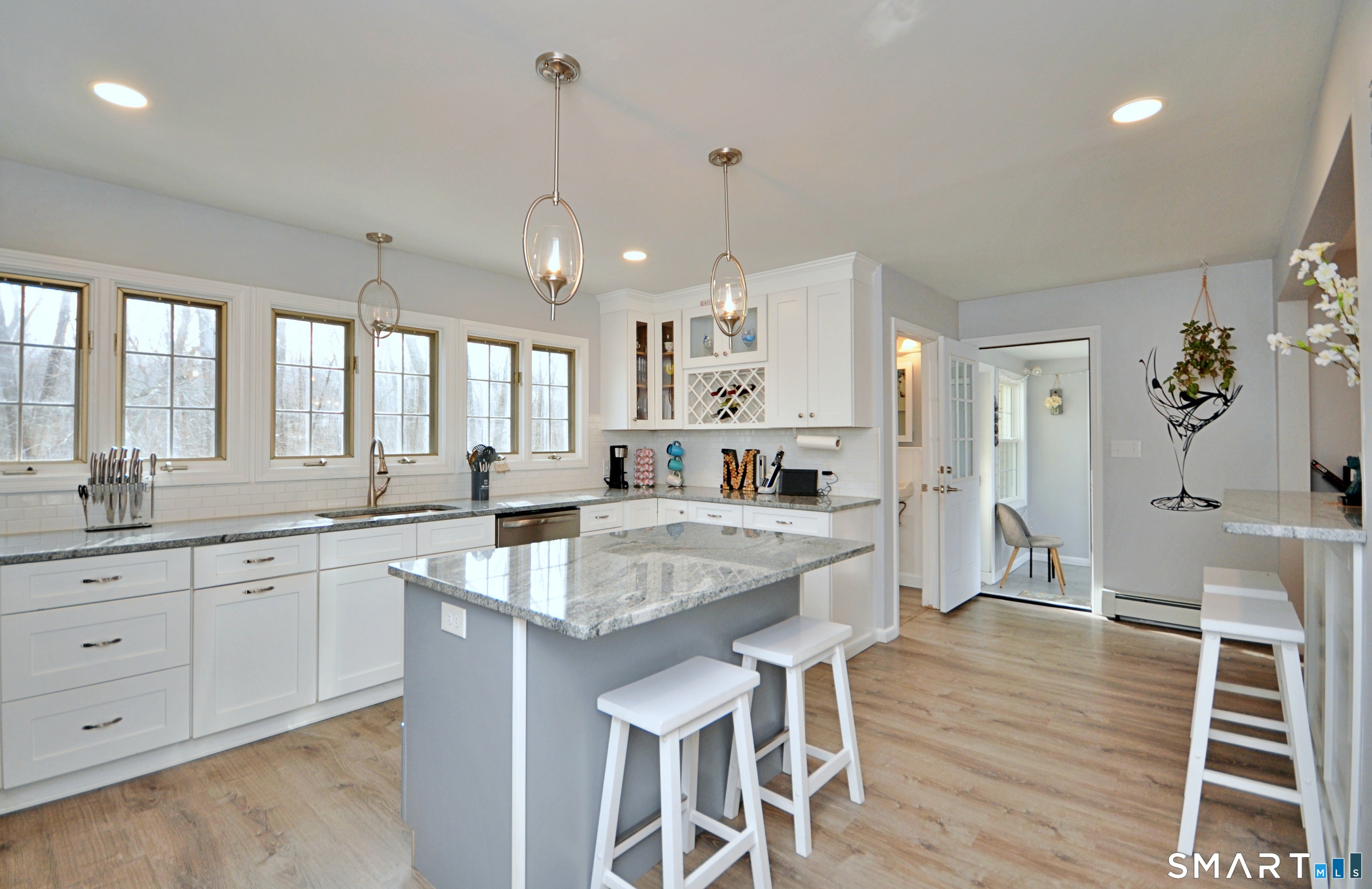21 Maple Drive Prospect, CT 06712 - Photo 3 of 29 a large kitchen with kitchen island a table and chairs in it