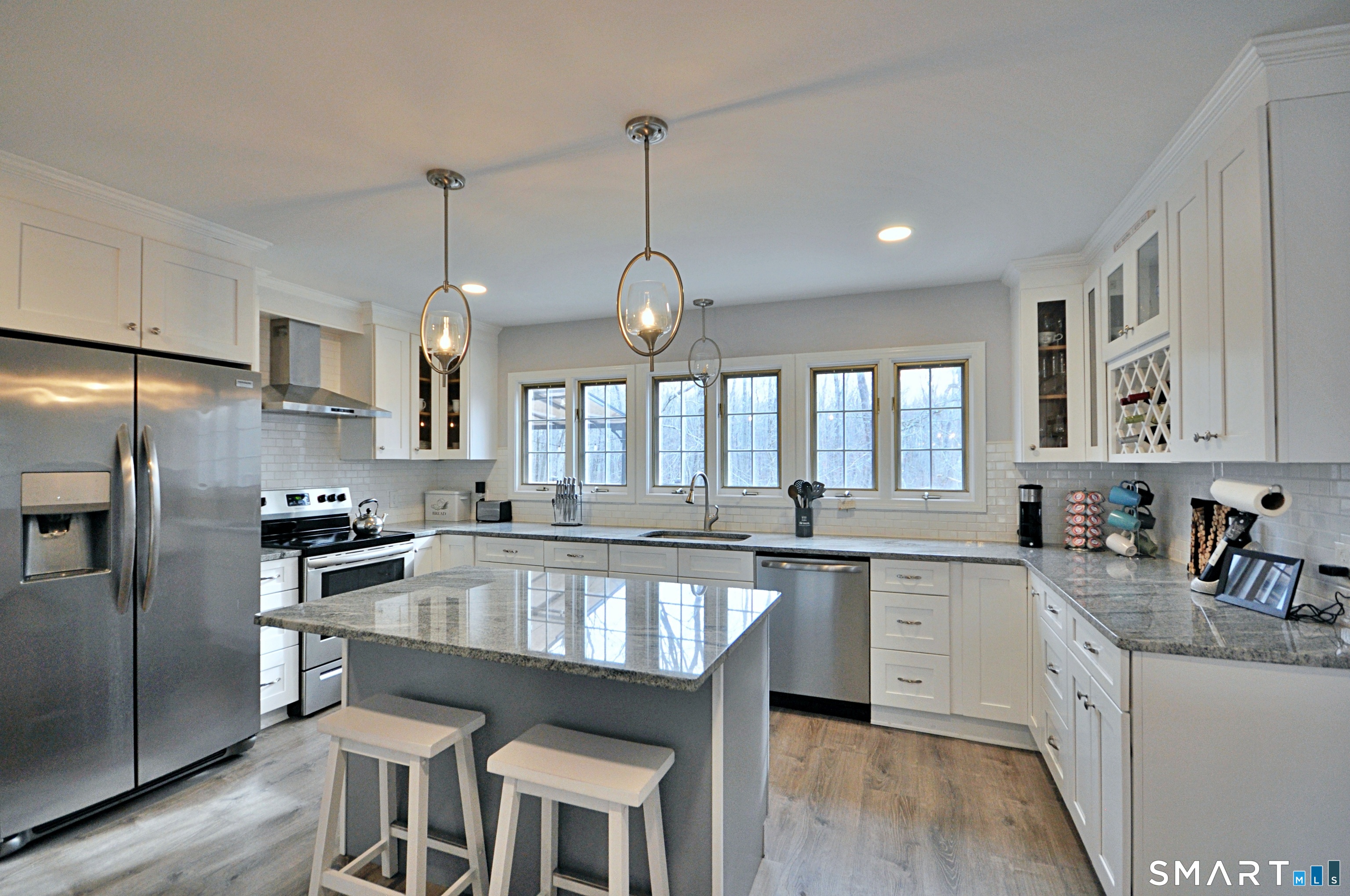 21 Maple Drive Prospect, CT 06712 - Photo 6 of 29 a large kitchen with kitchen island a large island in the center and stainless steel appliances