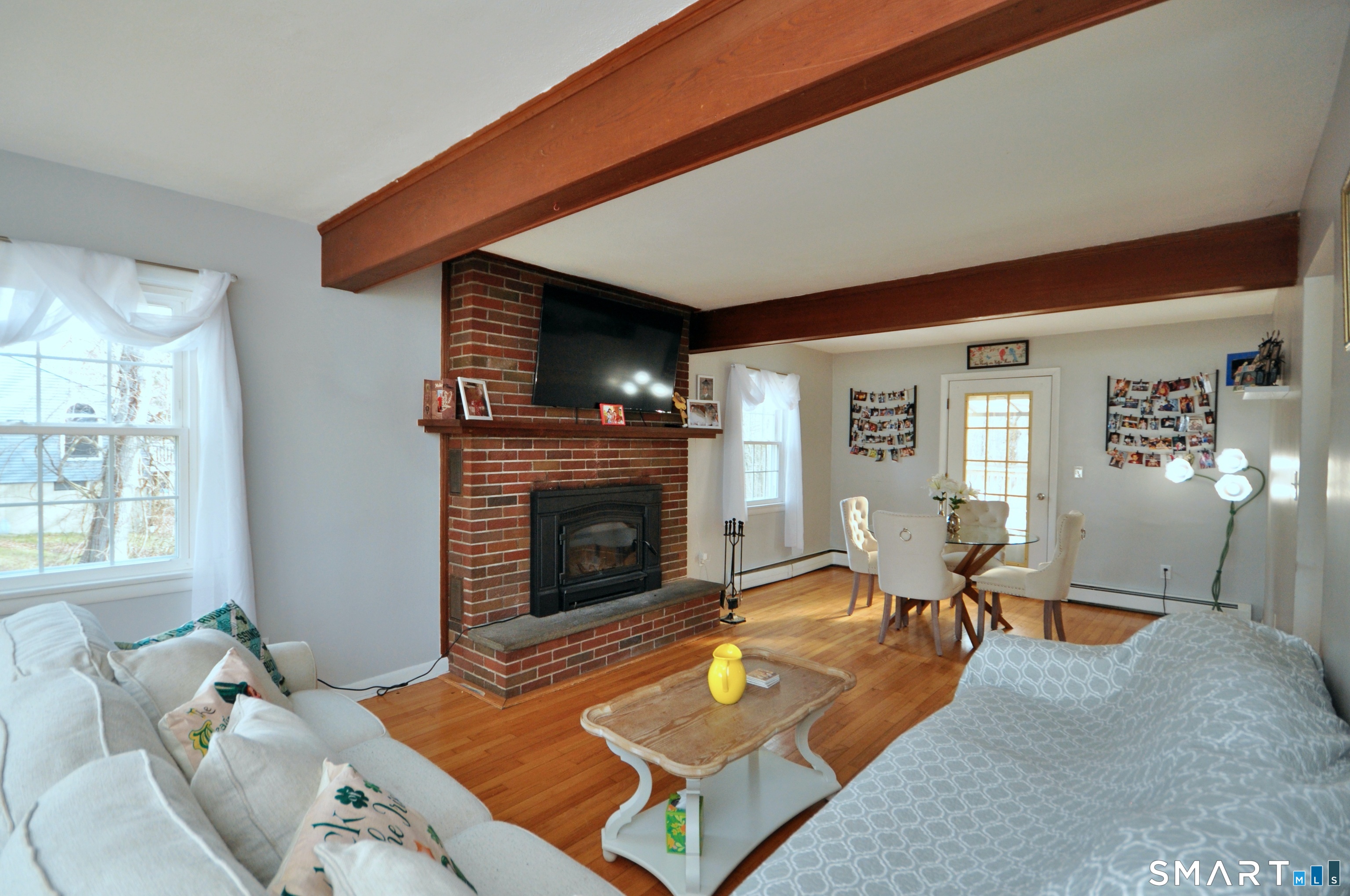 21 Maple Drive Prospect, CT 06712 - Photo 8 of 29 a living room with furniture a fireplace and wooden floor