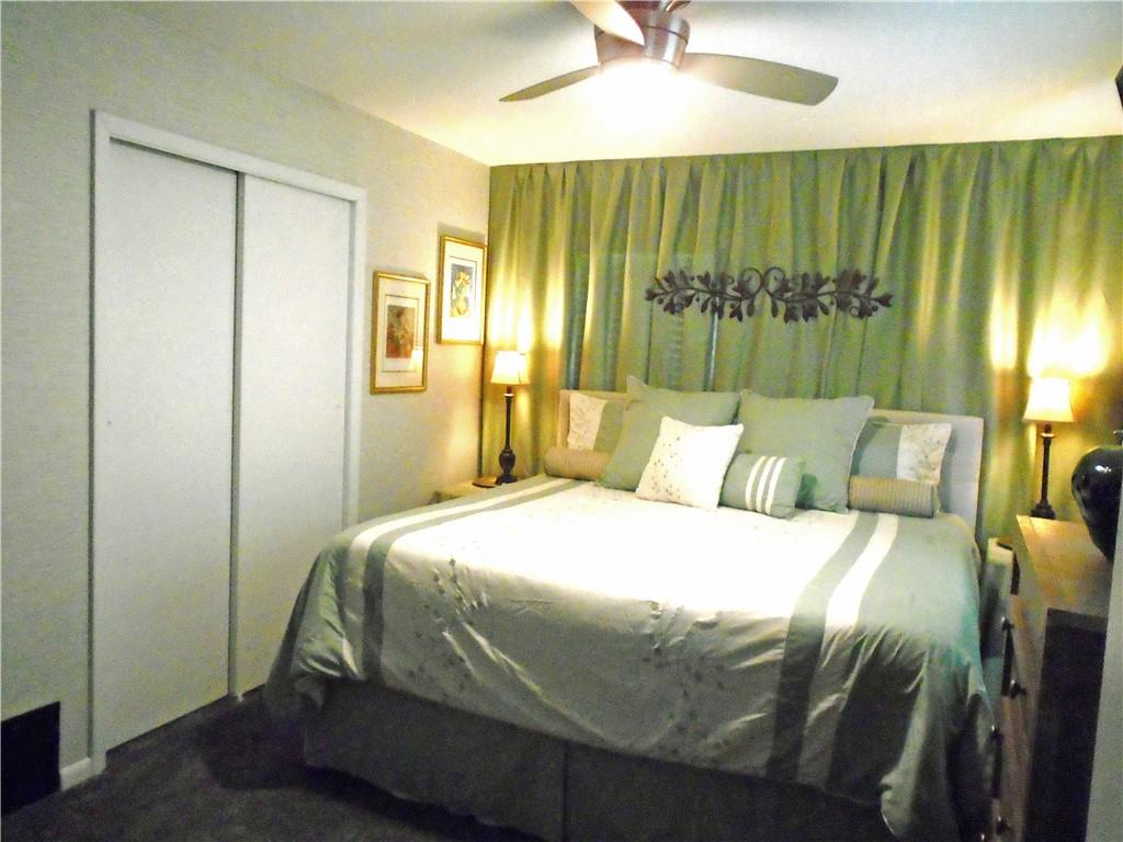 480 Heller Street Rochester, PA 15074 - Photo 21 of 31 a bedroom with a bed and a chandelier