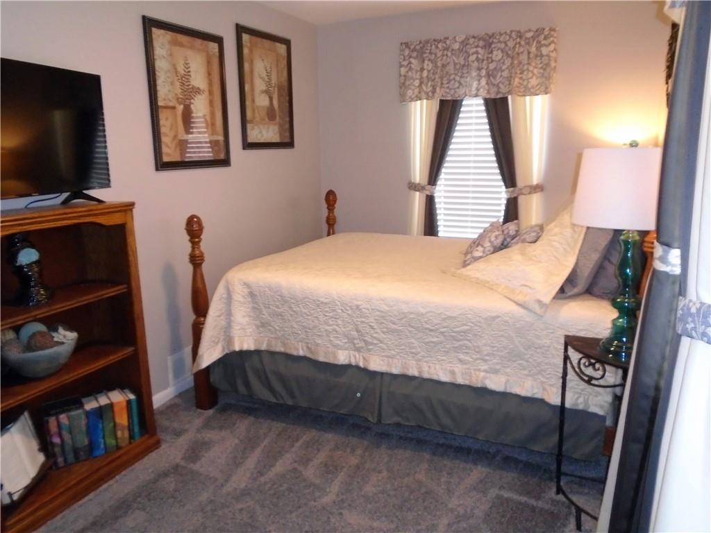 480 Heller Street Rochester, PA 15074 - Photo 23 of 31 a bedroom with a bed a flat screen tv and a window