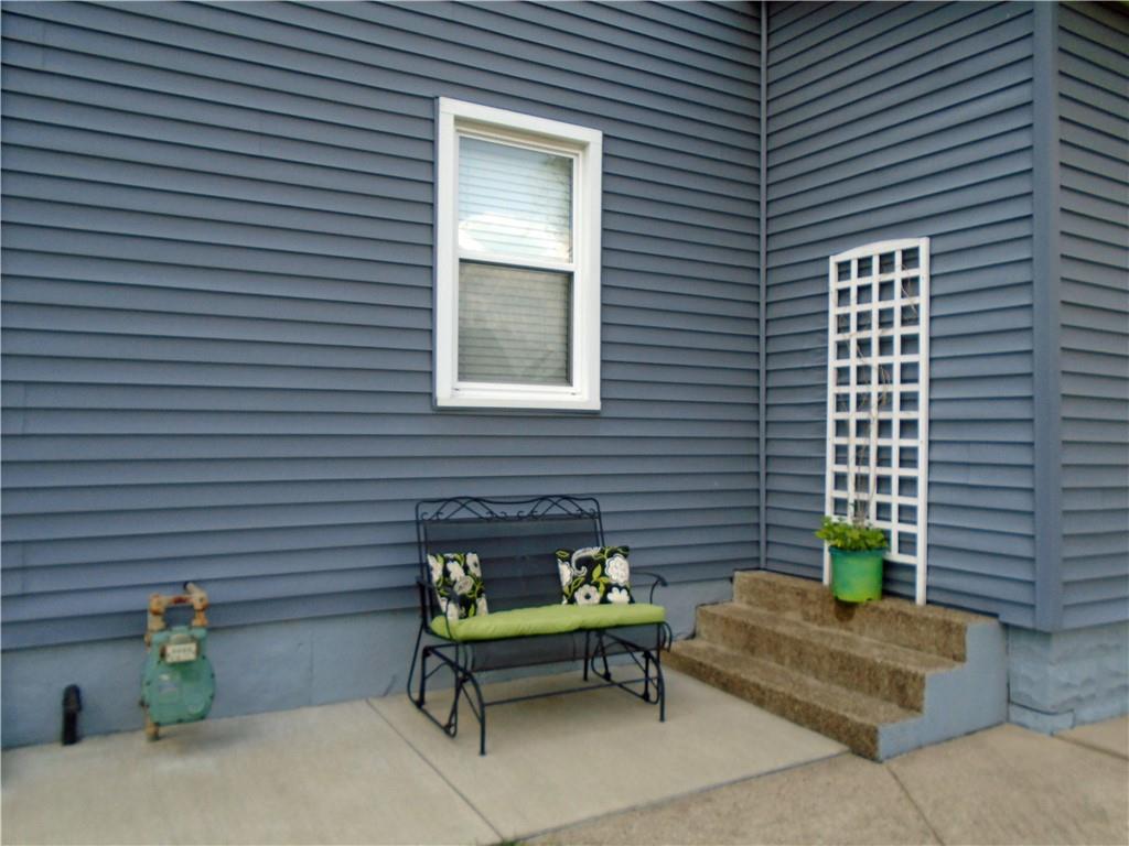 480 Heller Street Rochester, PA 15074 - Photo 27 of 31 a green bench sitting in front of a house
