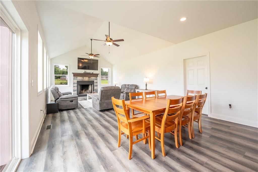 356 Stone Church Road Hunker, PA 15639 - Photo 11 of 40 a view of a dining room with furniture window and wooden floor
