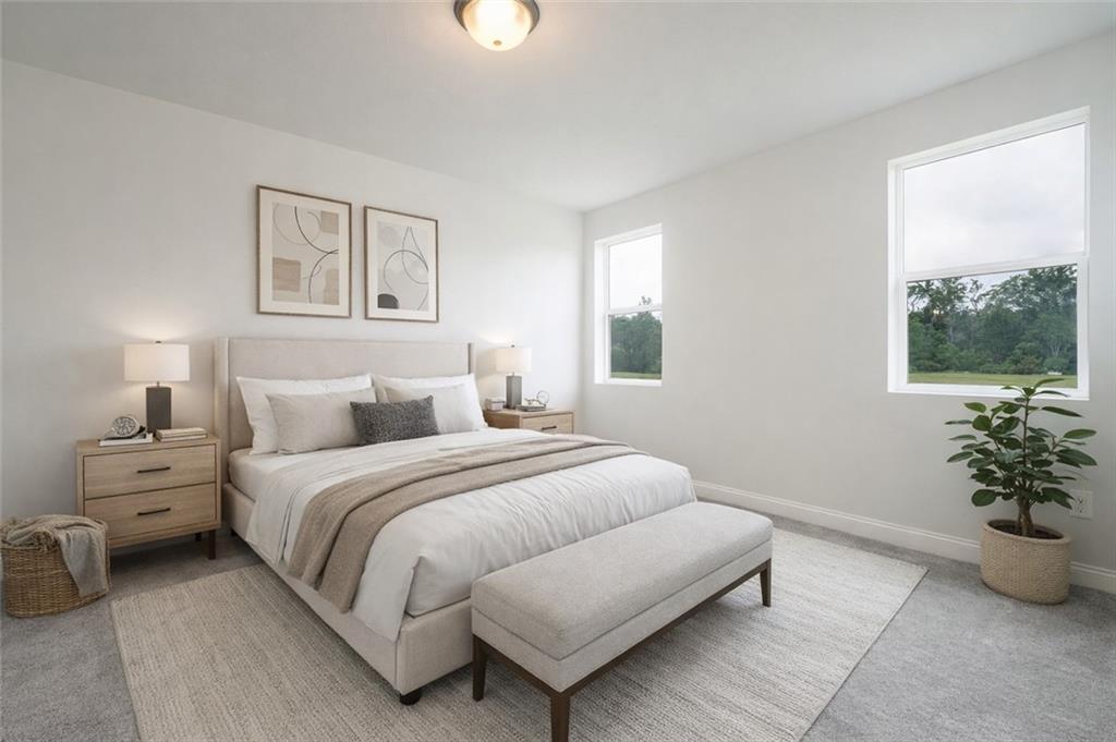 356 Stone Church Road Hunker, PA 15639 - Photo 15 of 40 a bedroom with a bed and a potted plant