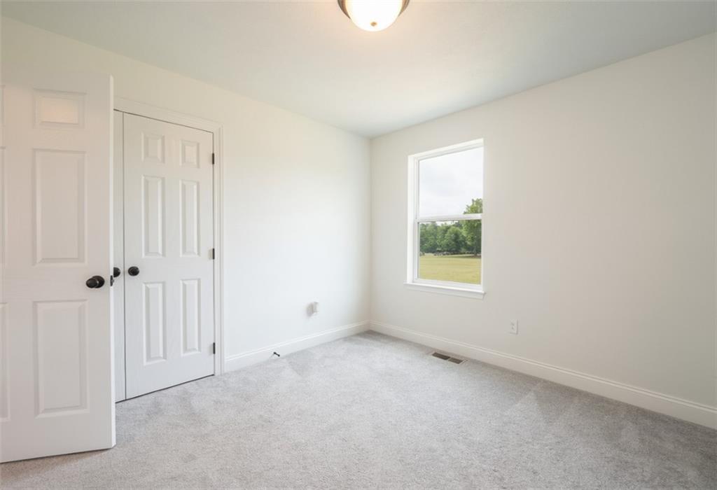 356 Stone Church Road Hunker, PA 15639 - Photo 22 of 40 a view of an empty room with a window