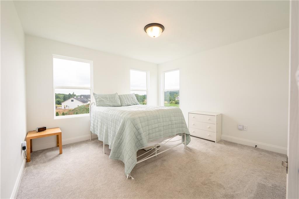 356 Stone Church Road Hunker, PA 15639 - Photo 25 of 40 a bedroom with a bed and a window