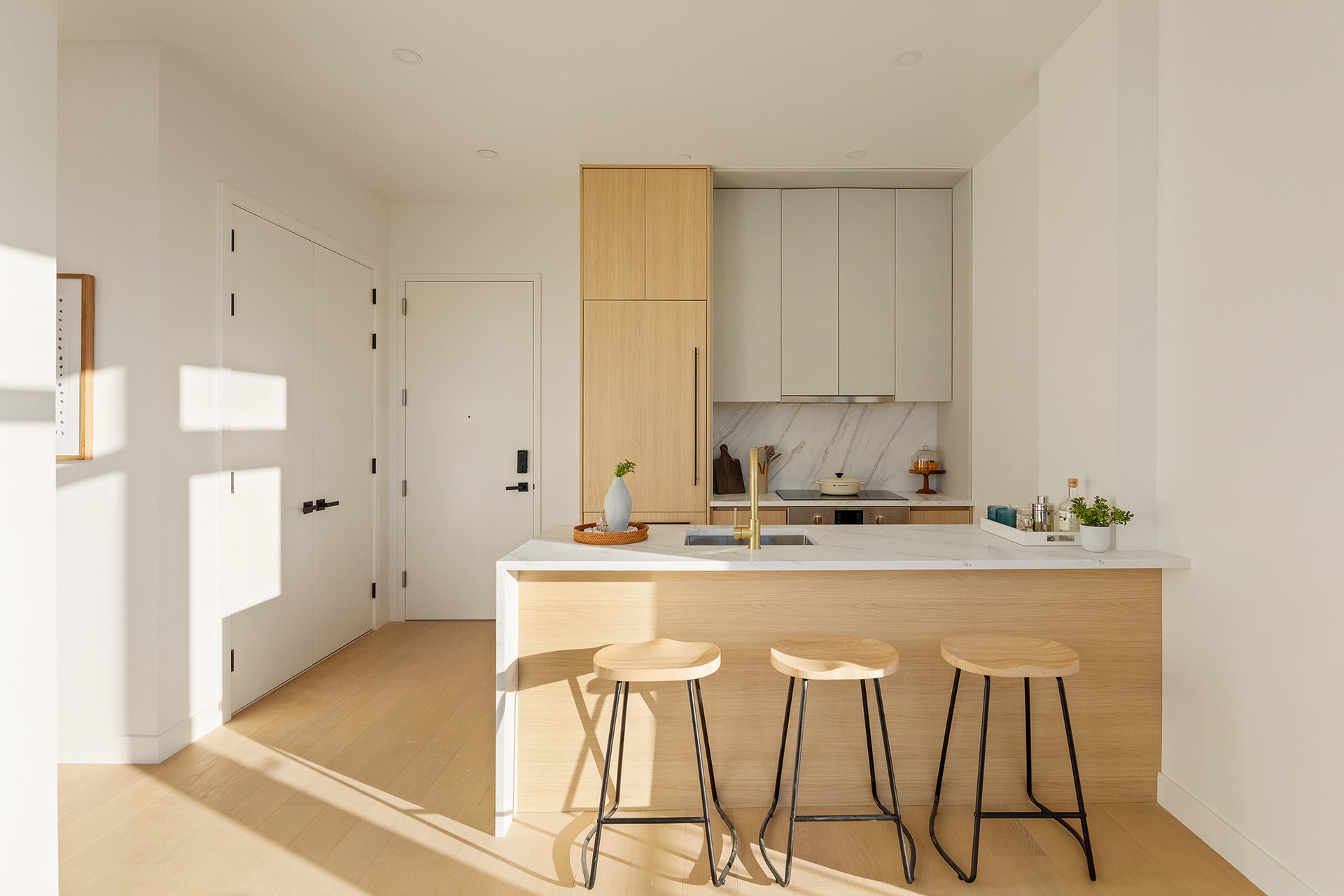 1027 Bushwick Avenue, Unit 2D Brooklyn, NY 11221 - Photo 3 of 14 a kitchen with stainless steel appliances granite countertop a stove a sink and white cabinets with wooden floor