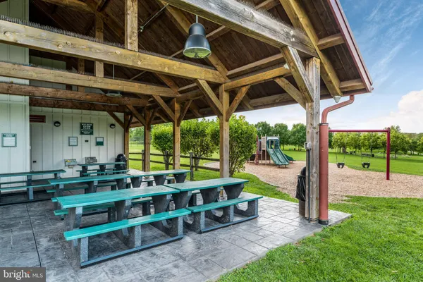 a view of a porch with furniture and garden